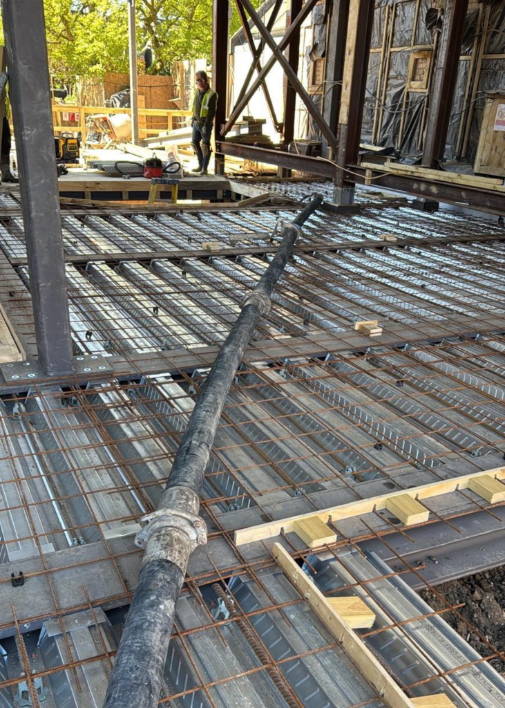 A King Concrete Pumping line pump feeding concrete on site near East Grinstead